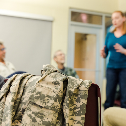military uniform laying across a chair in a support group circle